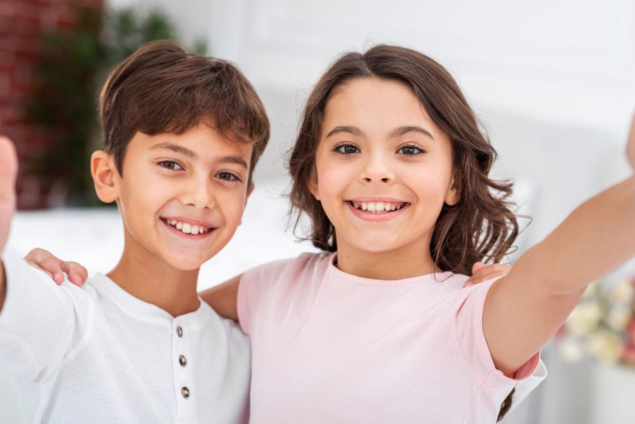 Young boy and girl smiling
