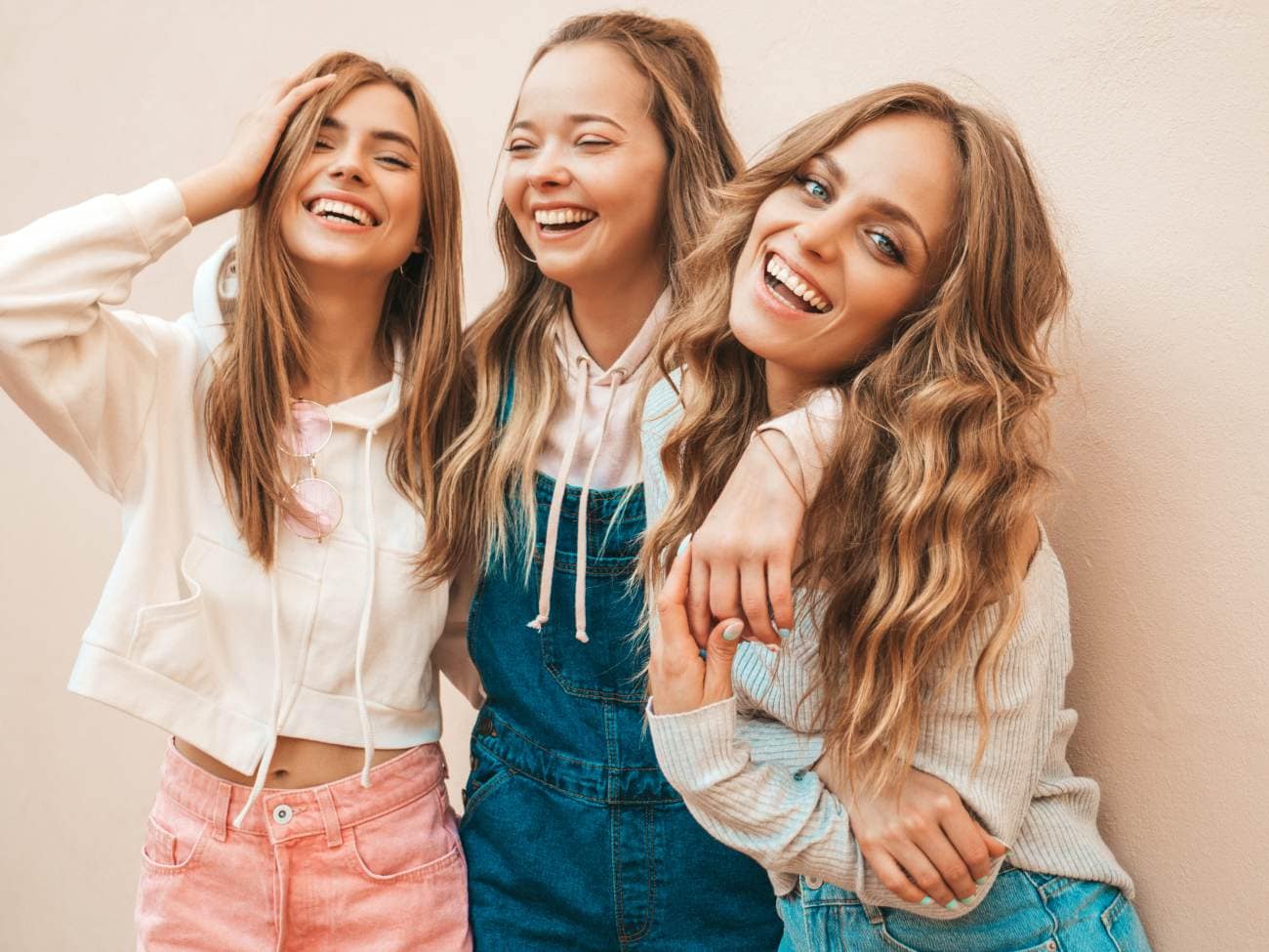 Three young girls smiling and laughing